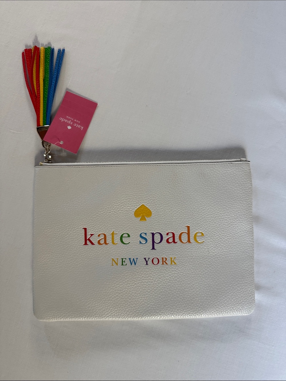kate spade NWT Kourtney Pride Clutch, White with Rainbow Logo and Tassel